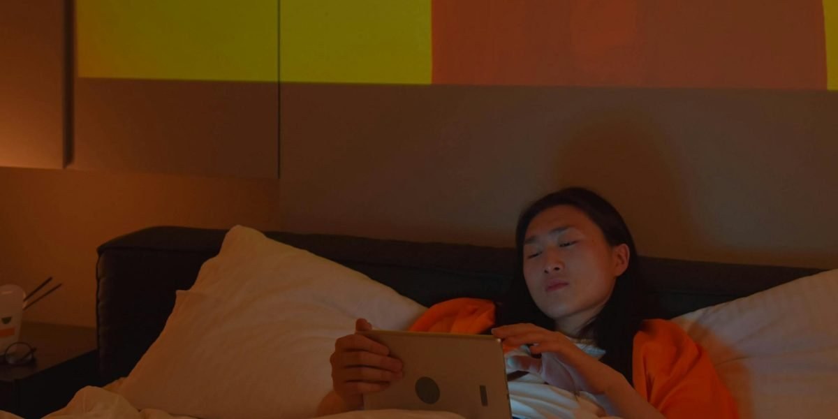 Person reading mental health resources on a tablet at home