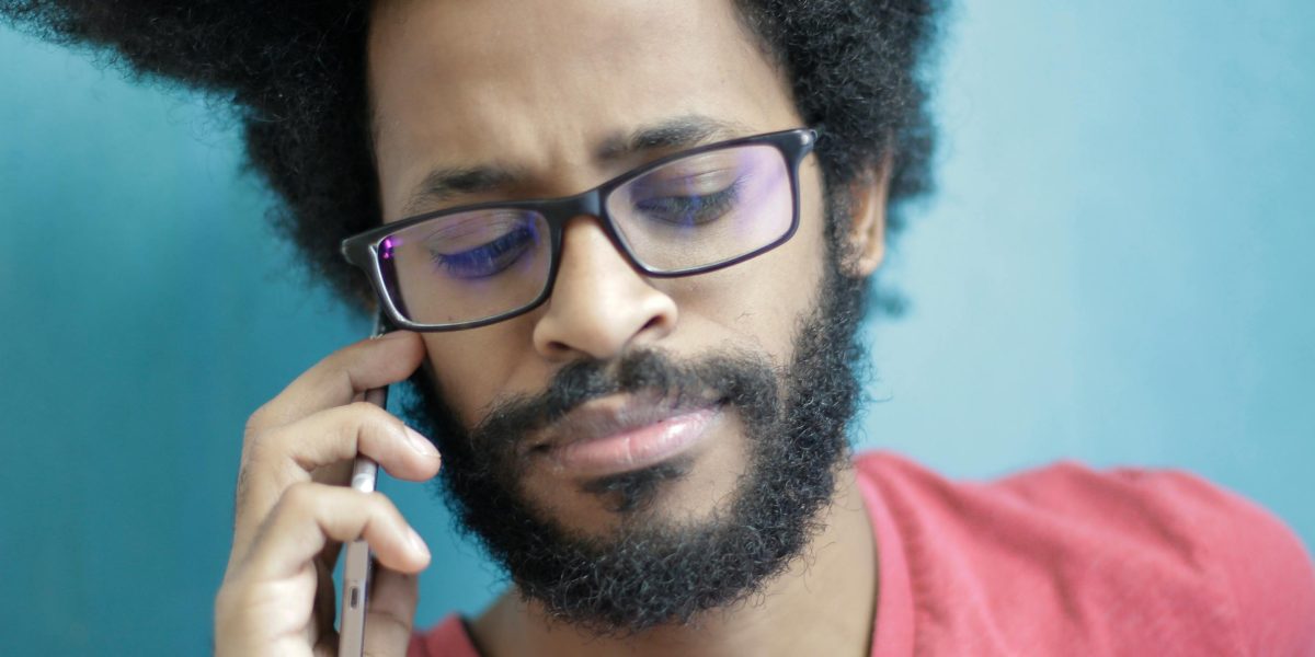 A person engaging in a calm, confidential conversation for emotional support.
