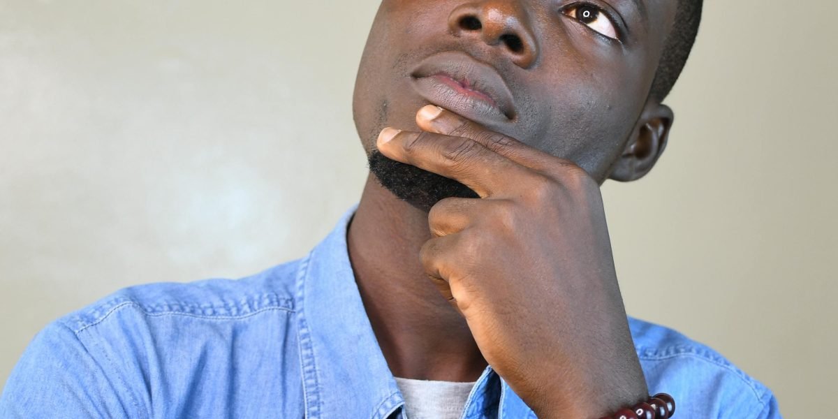 A person thoughtfully considering the best course of action during a mental health concern.