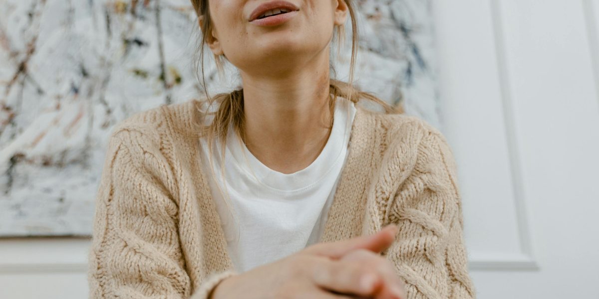 A person looking thoughtful and slightly anxious, reflecting the confusion people feel about mental health symptoms.
