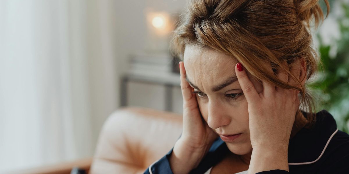 A person looking overwhelmed, symbolizing the internal struggle with complex thoughts and emotions.