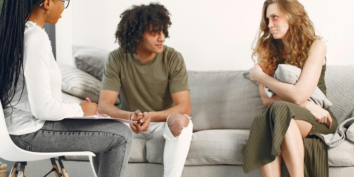 Individuals sharing experiences in a support group, emphasizing the importance of community for caregivers and those with mental health challenges.