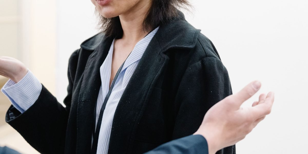 A professional guiding someone with a supportive and clear explanation, reflecting an effective call to action.