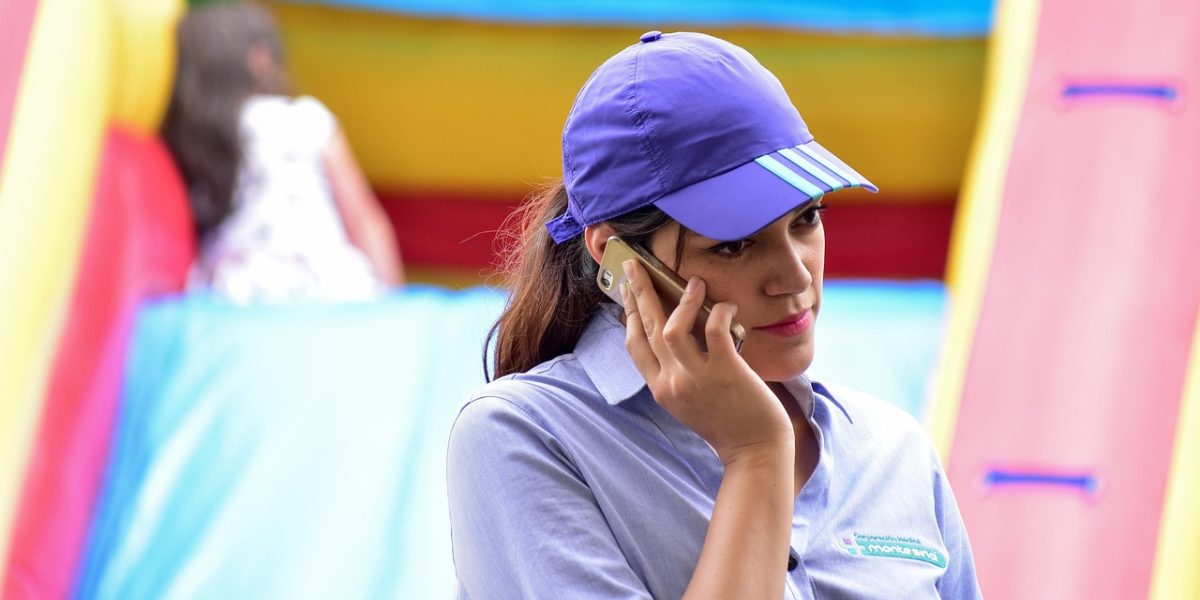 A person speaks on the phone with a calm demeanor, illustrating the relief and connection found through a helpline.