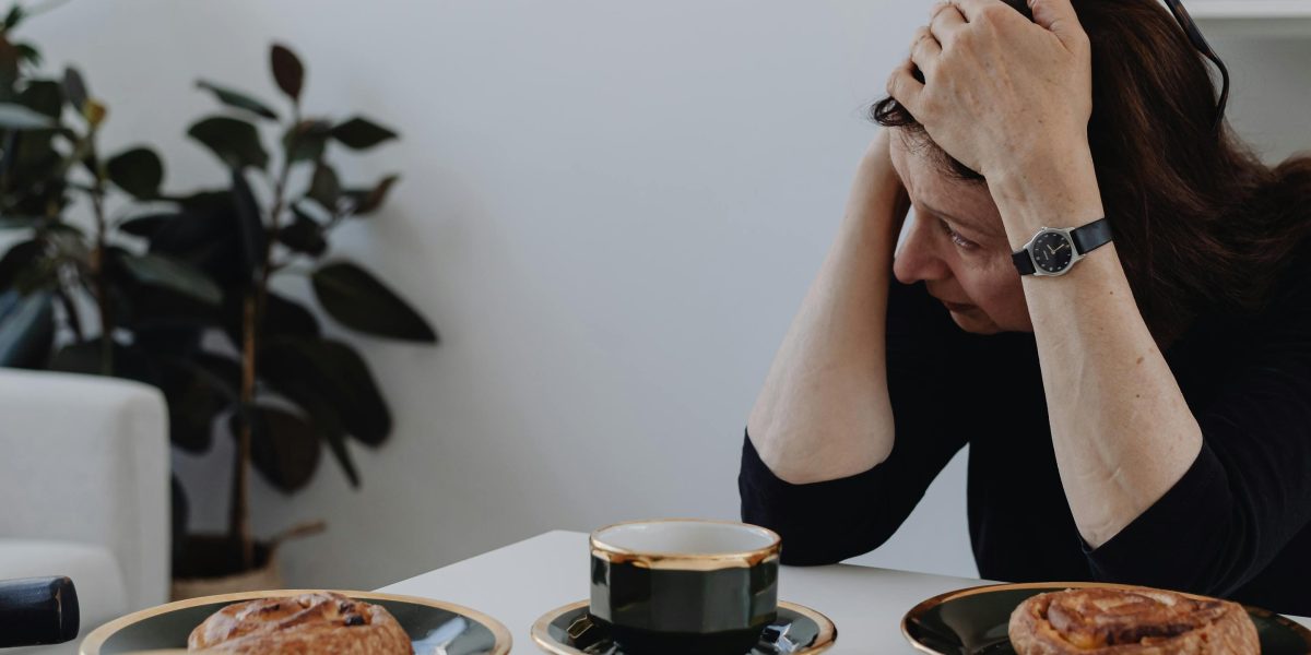 A person appearing deep in thought, perhaps grappling with complex feelings or decisions.