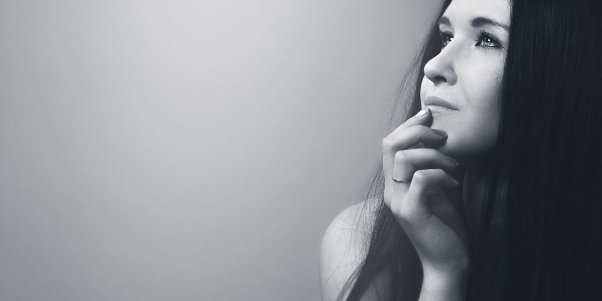 A person reflecting calmly, representing the journey towards improved mental well-being.