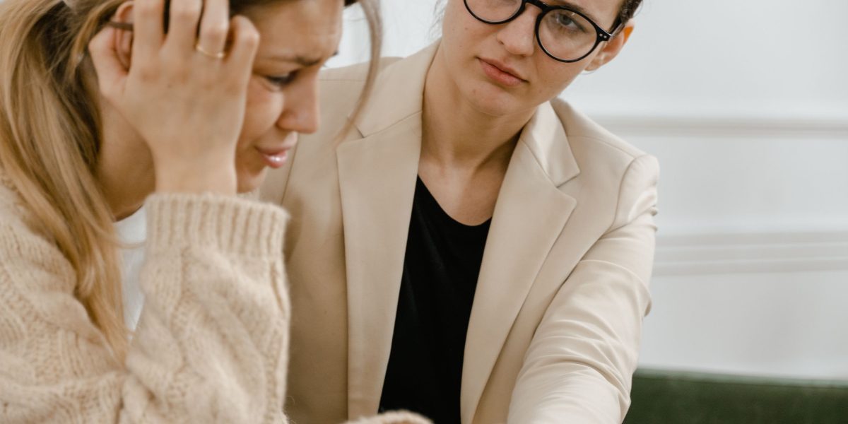 A compassionate counselor offers guidance and support to an individual navigating challenges.