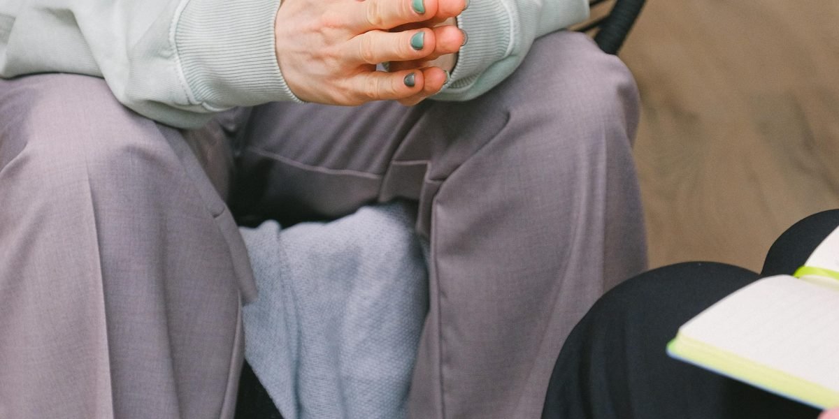A person engaging in a therapy session, actively participating in self-reflection and discussion.