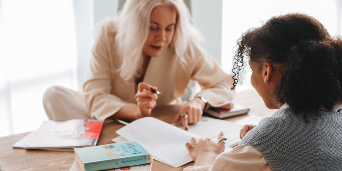 A student engages in a confidential conversation with a school counselor, representing available support systems.