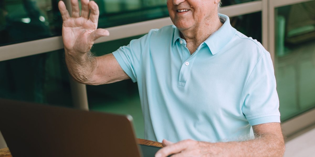 A person comfortably participates in a virtual therapy session from home, highlighting the flexibility of telehealth.