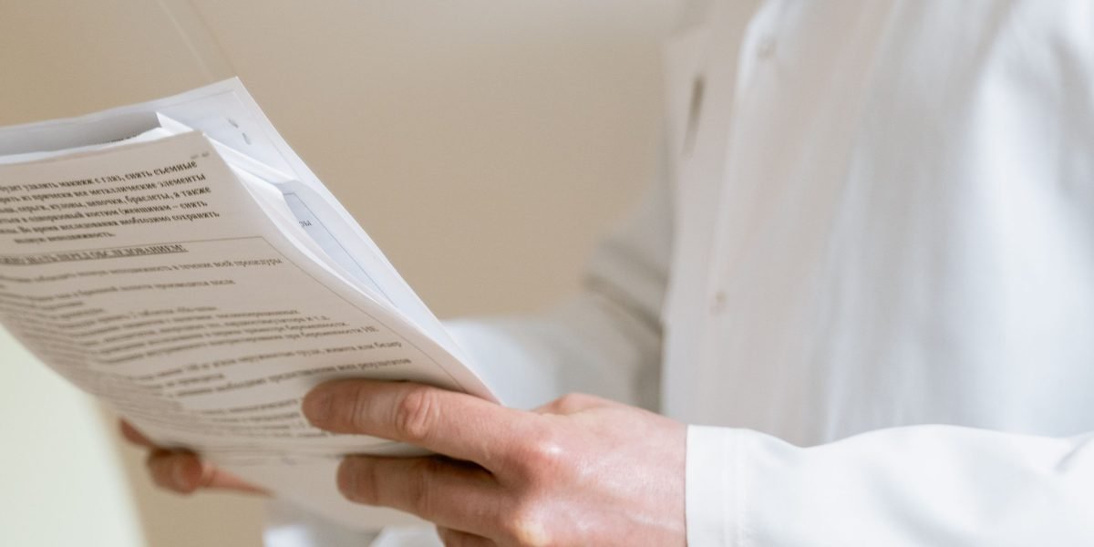 A person calmly reviews their medical test results, empowered by easy access to their health information.