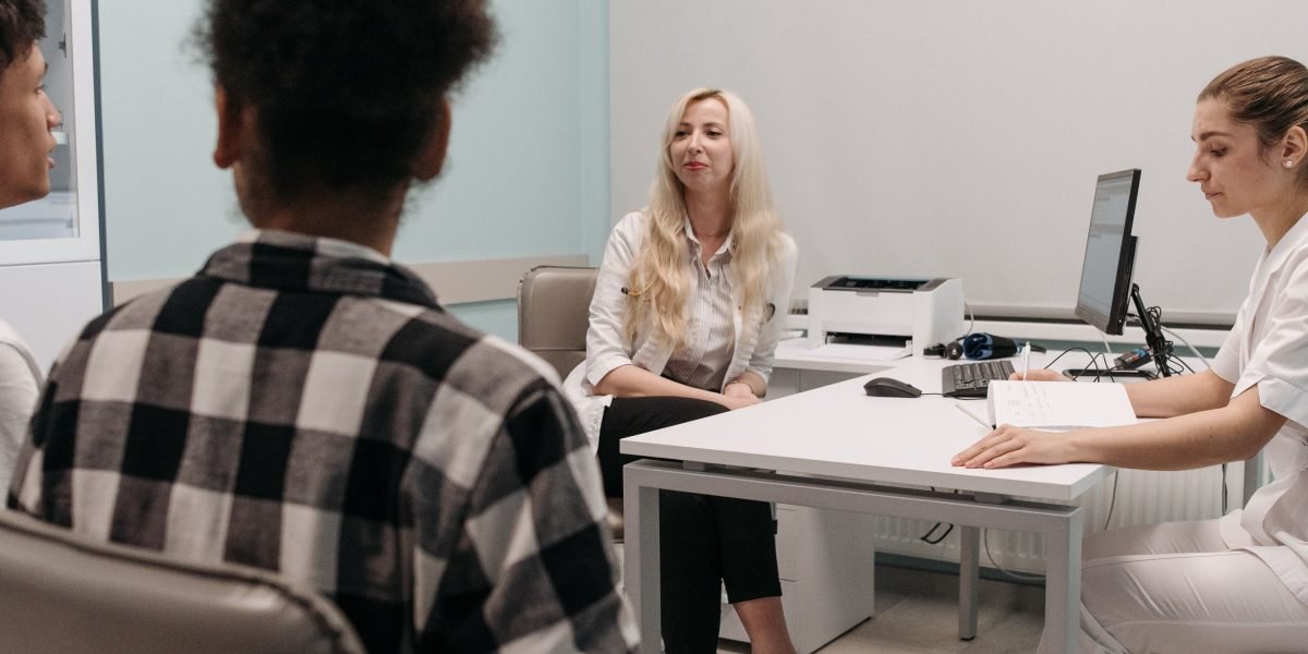 A person thoughtfully composing a message, representing secure and quiet communication with their healthcare provider.