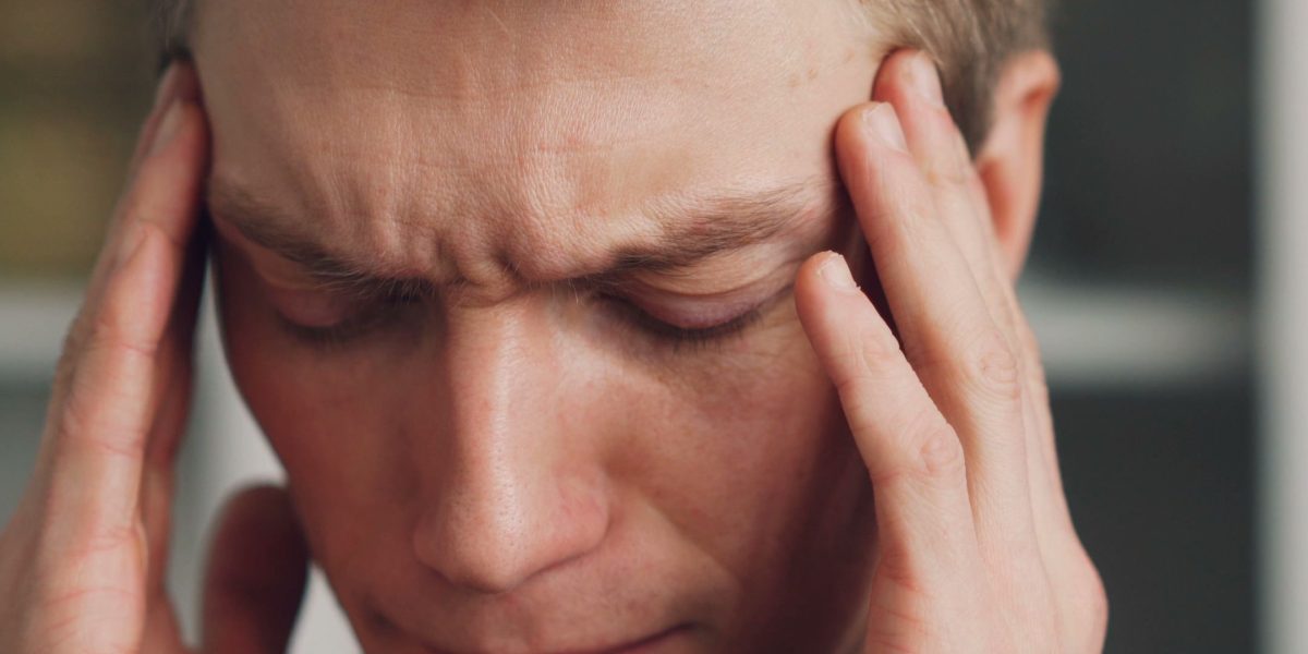 A person contemplating a complex situation, reflecting the initial feeling of being overwhelmed when seeking support.