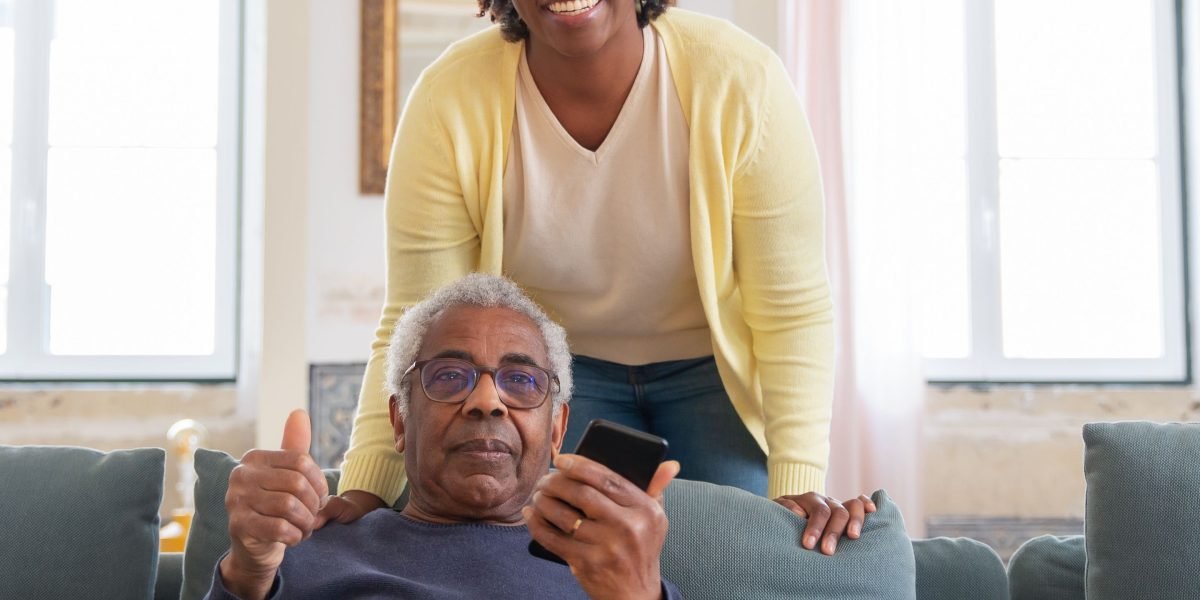 A caregiver gently supporting an older family member, illustrating the importance of familial and community care.