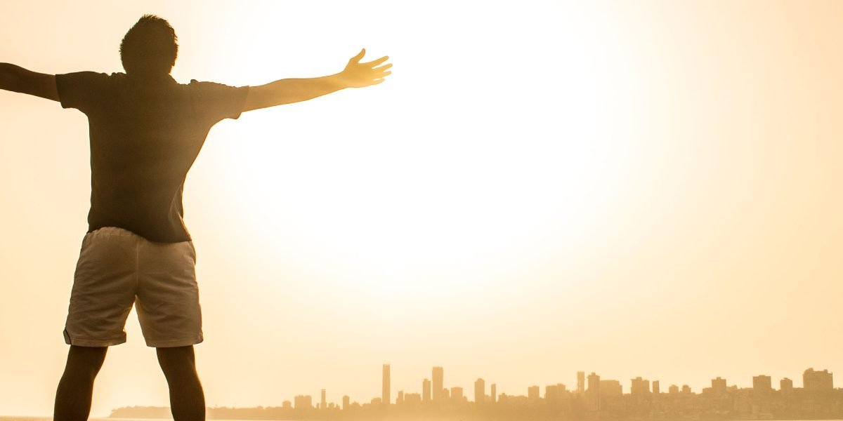 A person looking calmly into the distance, representing the sense of relief and hope found through accessible mental health support.