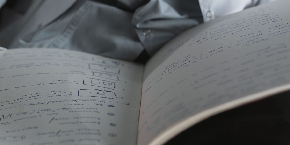 An individual carefully reviews their health records, reflecting on the information and preparing for discussions with their provider.